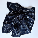 Lightweight textured square scarf with a soft finish, ideal for accessorizing hair, necklines, or handbags with effortless elegance.