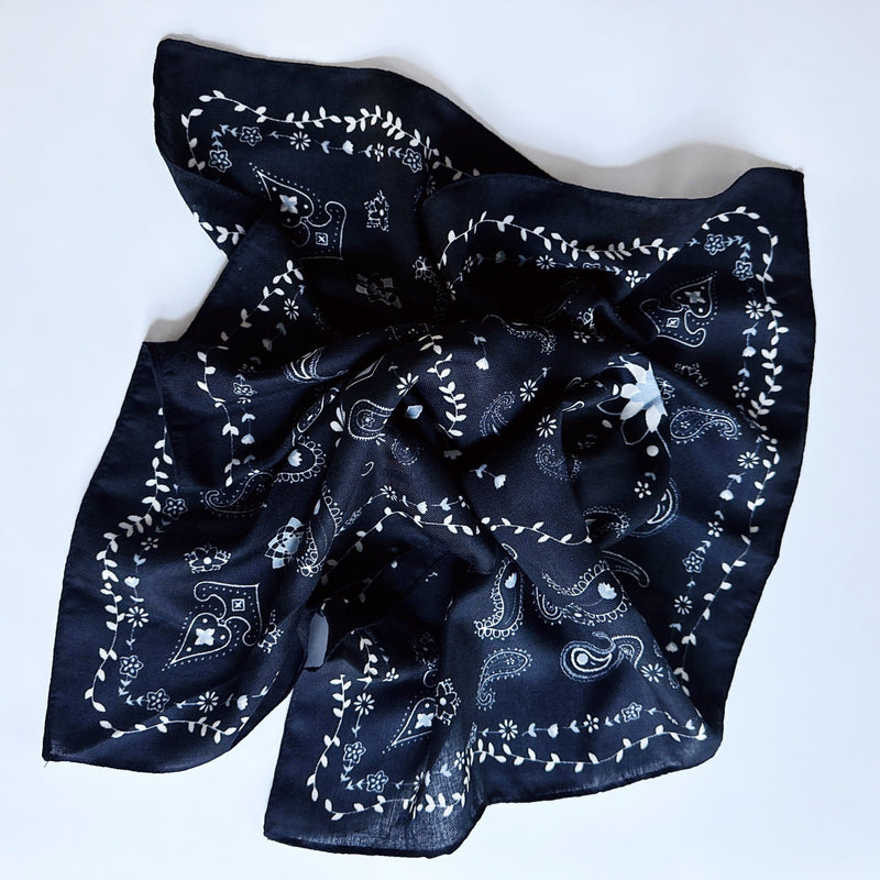 Lightweight textured square scarf with a soft finish, ideal for accessorizing hair, necklines, or handbags with effortless elegance.