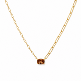 Gold necklace with a square brown gemstone on a white background