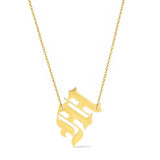Gold-tone chain necklace featuring a bold Gothic-style initial charm that hangs asymmetrically to the side, adding a vintage-inspired yet edgy detail to your layered look.