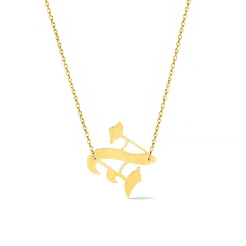 Gold-tone chain necklace featuring a bold Gothic-style initial charm that hangs asymmetrically to the side, adding a vintage-inspired yet edgy detail to your layered look.