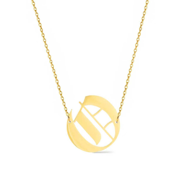 Gold-tone chain necklace featuring a bold Gothic-style initial charm that hangs asymmetrically to the side, adding a vintage-inspired yet edgy detail to your layered look.