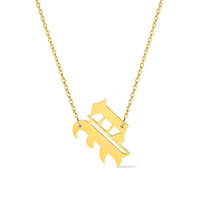 Gold-tone chain necklace featuring a bold Gothic-style initial charm that hangs asymmetrically to the side, adding a vintage-inspired yet edgy detail to your layered look.
