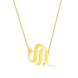 Gold-tone chain necklace featuring a bold Gothic-style initial charm that hangs asymmetrically to the side, adding a vintage-inspired yet edgy detail to your layered look.