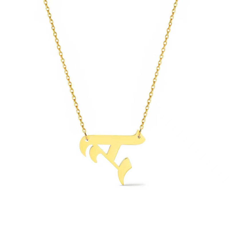 Gold-tone chain necklace featuring a bold Gothic-style initial charm that hangs asymmetrically to the side, adding a vintage-inspired yet edgy detail to your layered look.