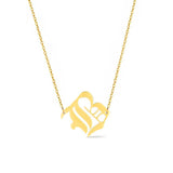 Gold-tone chain necklace featuring a bold Gothic-style initial charm that hangs asymmetrically to the side, adding a vintage-inspired yet edgy detail to your layered look.
