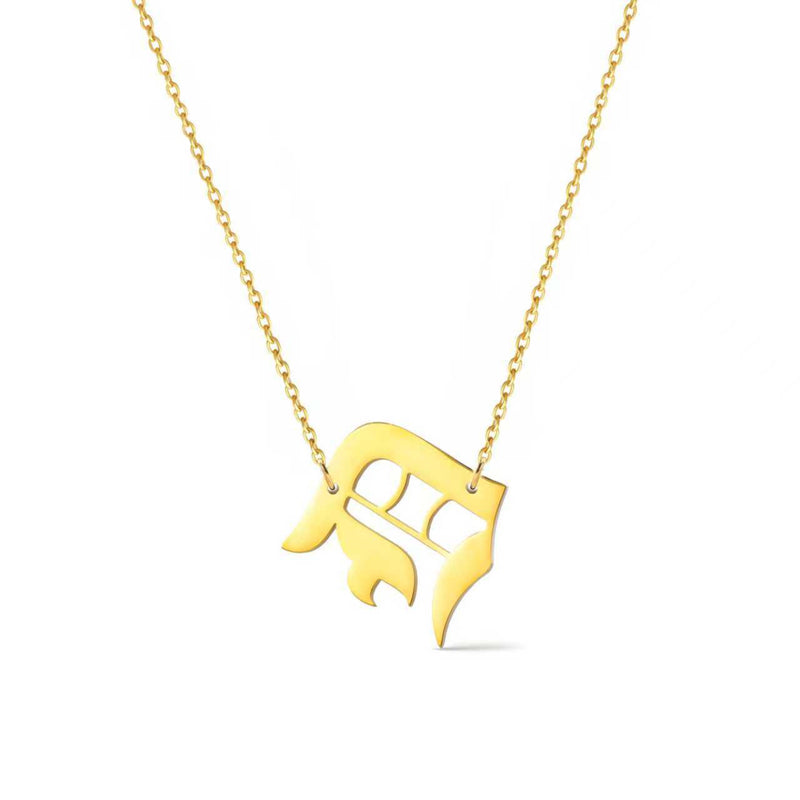 Gold-tone chain necklace featuring a bold Gothic-style initial charm that hangs asymmetrically to the side, adding a vintage-inspired yet edgy detail to your layered look.