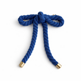 Rope-style hair clip in a sculptural bow shape, featuring a textured twisted design that adds playful elegance and volume to any hairstyle.