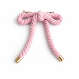 Rope-style hair clip in a sculptural bow shape, featuring a textured twisted design that adds playful elegance and volume to any hairstyle.