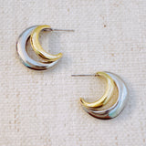 Stylish two-toned hoop earrings featuring paired gold and silver finishes in a sleek, modern design.