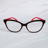 Cat-eye glasses with red interior on a white background