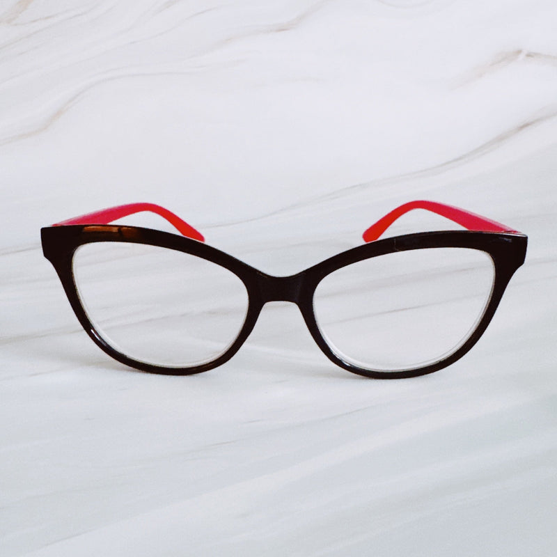 Cat-eye glasses with red interior on a white background