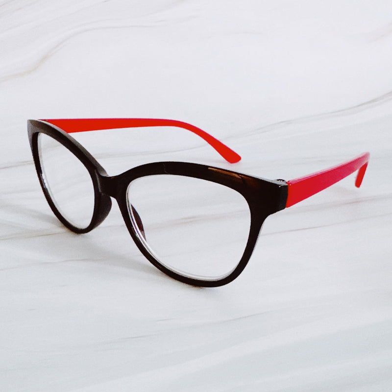 Eyeglasses with a brown frame and red arms on a white background