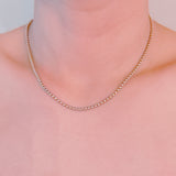 Silver-tone U-link chain necklace featuring a bold, gold lock pendant for a modern, edgy statement.