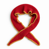 A red knit scarf with a mustard yellow textured edge, arranged in a loop on a plain white background.