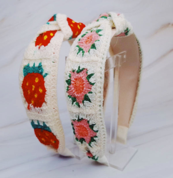 Soft crochet headband in a vintage-inspired design, featuring an intricate woven pattern and a classic look.