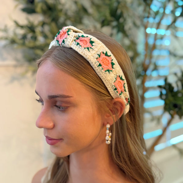 Soft crochet headband in a vintage-inspired design, featuring an intricate woven pattern and a classic look.