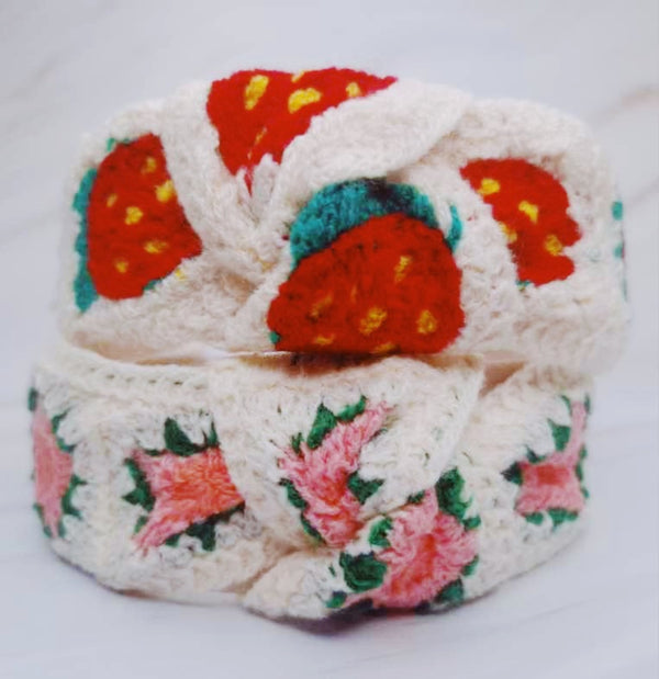 oft crochet headband in a vintage-inspired design, featuring an intricate woven pattern and a classic look.