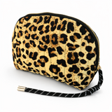 Quilted cosmetic case with a vintage-inspired leopard print design, featuring a soft padded texture and zip closure for stylish and functional storage.