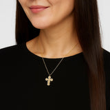 Elegant vintage-inspired necklace featuring a delicate cross pendant adorned with lustrous pearls and intricate detailing. Suspended from a fine chain, this piece blends timeless charm with a touch of sophistication—ideal for both faith-inspired style and classic fashion statements.