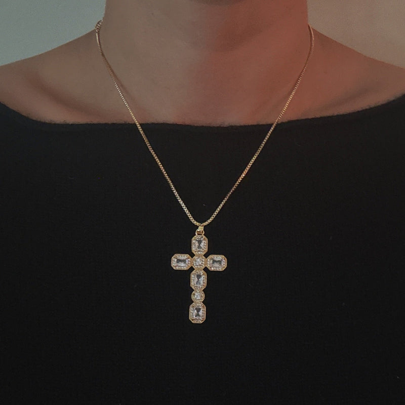 Gold-tone necklace featuring a vintage-inspired cross pendant adorned with sparkling crystals for a timeless and elegant look.
