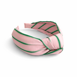 A striped fabric knot headband featuring a soft, twisted design and comfortable fit. This accessory adds a playful yet polished touch to any outfit, perfect for casual or chic looks