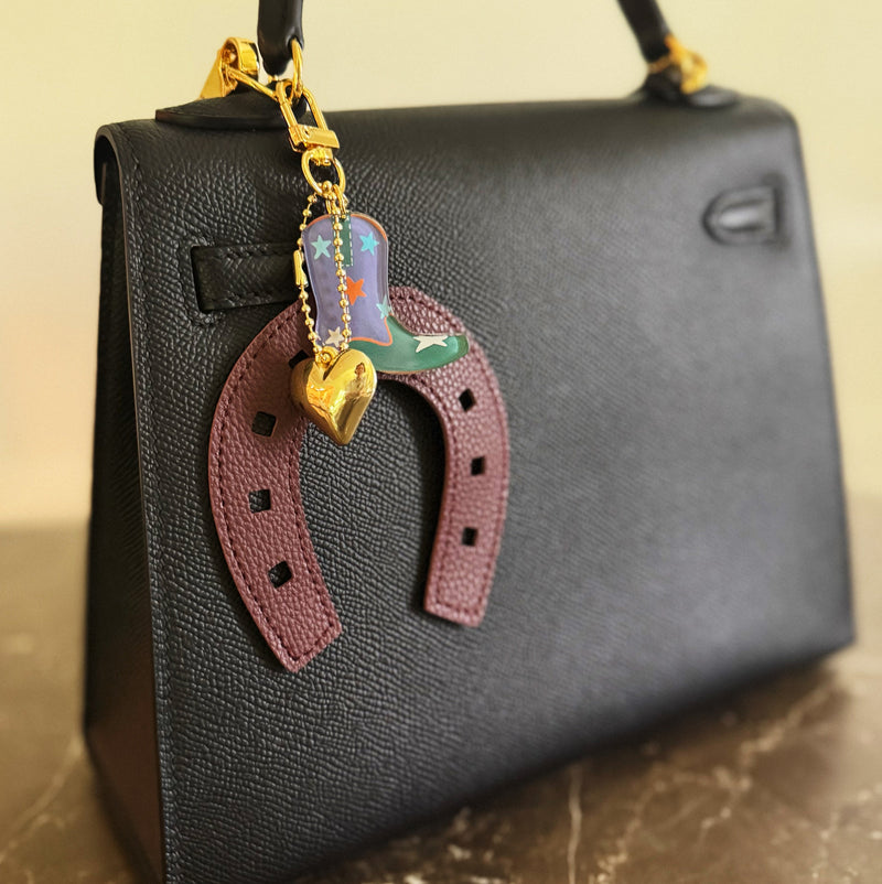Purple horseshoe bag charm with a colorful boot and golden star – lucky western theme