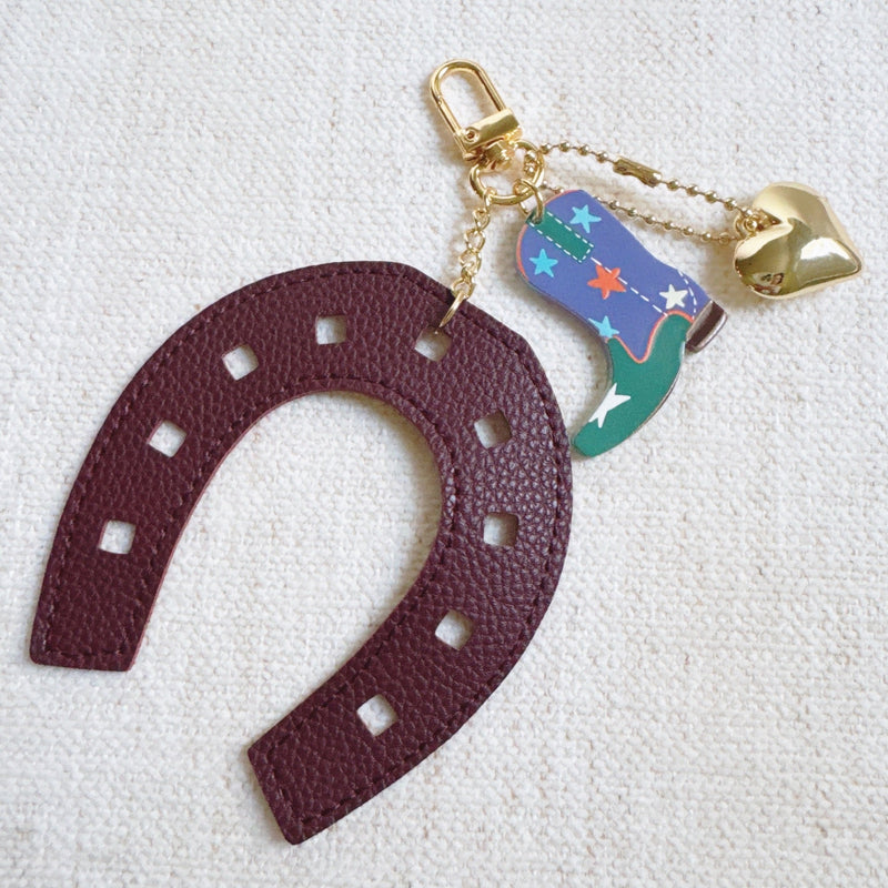 Purple horseshoe bag charm with a colorful boot and golden star – lucky western theme