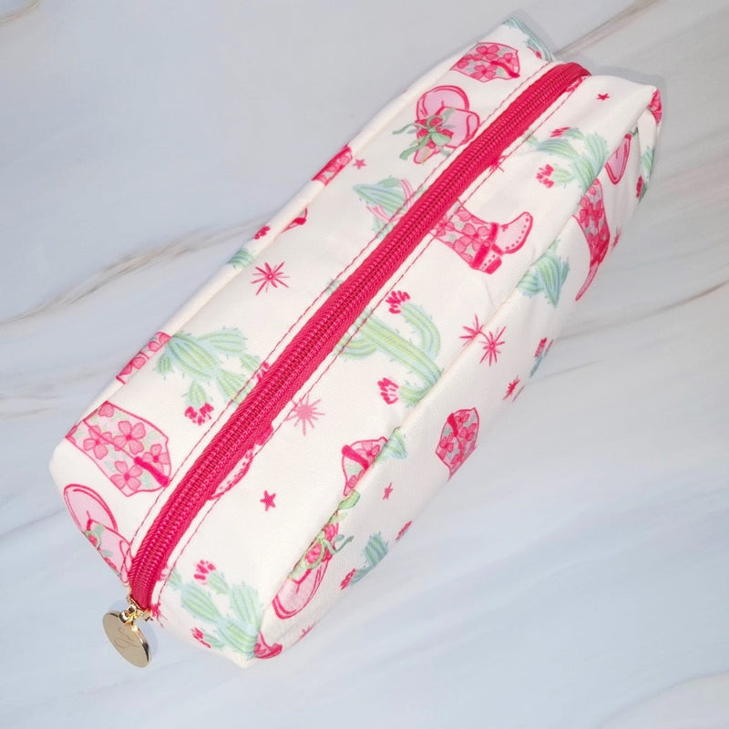 Compact cosmetic case with a playful Western-inspired design, ideal for daily use—featuring a zip closure and spacious interior to keep your beauty essentials organized in style