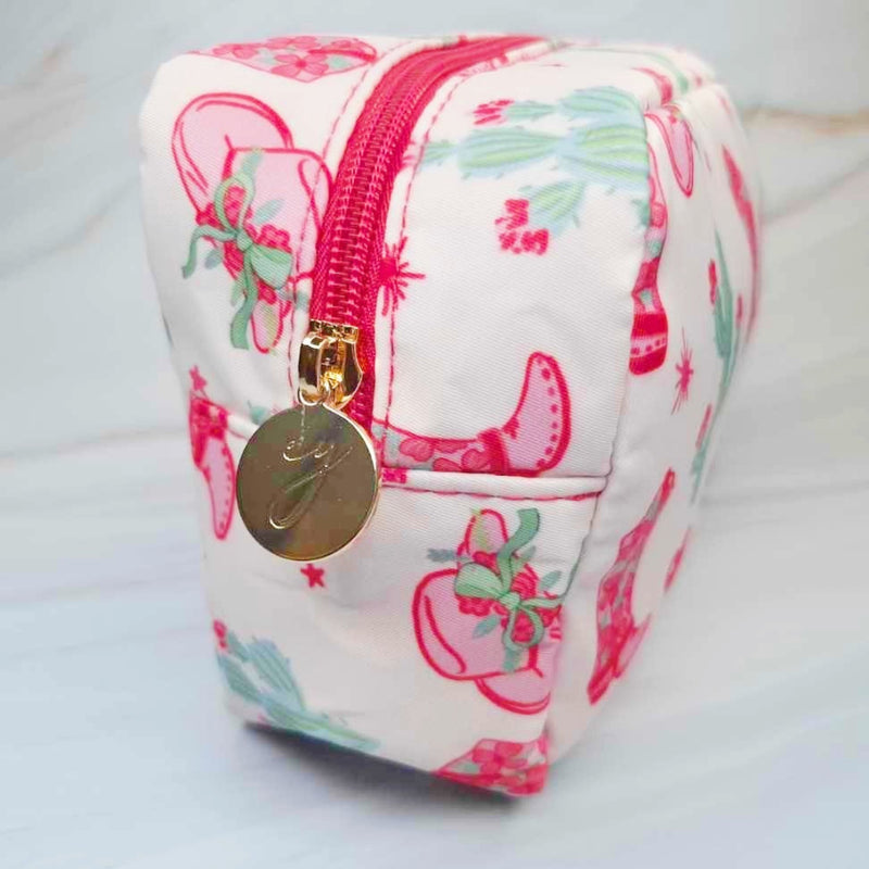 Compact cosmetic case with a playful Western-inspired design, ideal for daily use—featuring a zip closure and spacious interior to keep your beauty essentials organized in style
