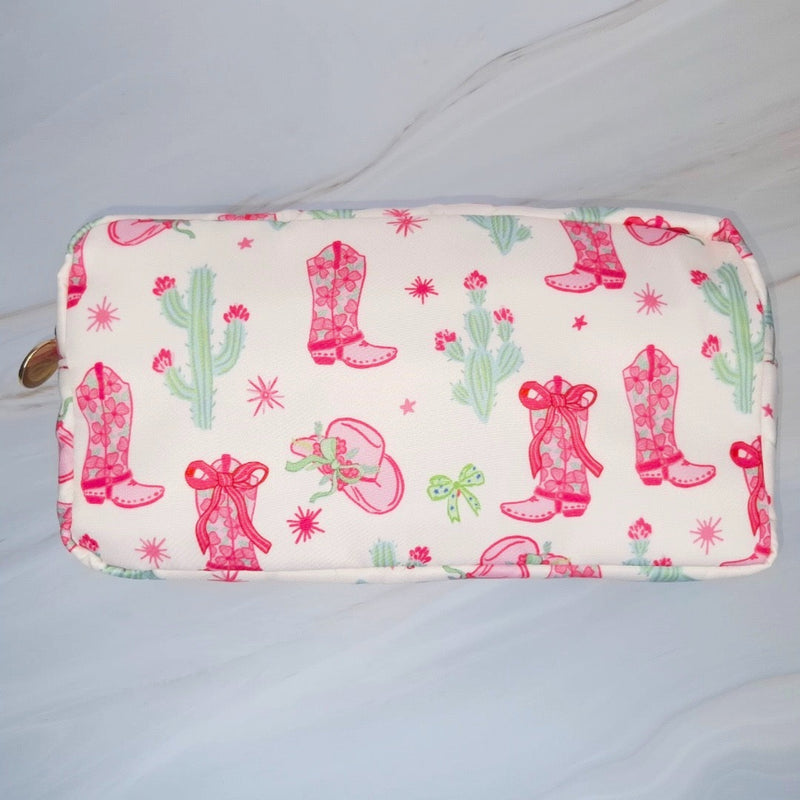 Compact cosmetic case with a playful Western-inspired design, ideal for daily use—featuring a zip closure and spacious interior to keep your beauty essentials organized in style