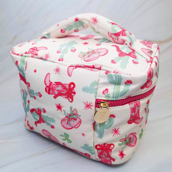 Stylish travel cosmetic case featuring a Western-inspired design with whimsical details, sturdy zip closure, and a convenient top handle—perfect for organizing beauty essentials on the go.