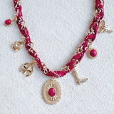 Chain necklace woven with printed scarf fabric, adorned with Western-themed charms including a boot, sunburst, and sheriff star.