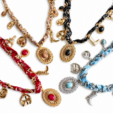Collection of colorful bracelets with various designs on a white background