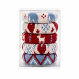 A stack of five knitted socks in a clear plastic box, featuring festive holiday patterns in red, blue, and cream.