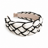 Black and white braided headband on a white background