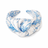 White headband with blue floral pattern on a white background