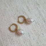 Gold cabled huggie hoop earrings with natural freshwater pearls – elegant and minimalist design