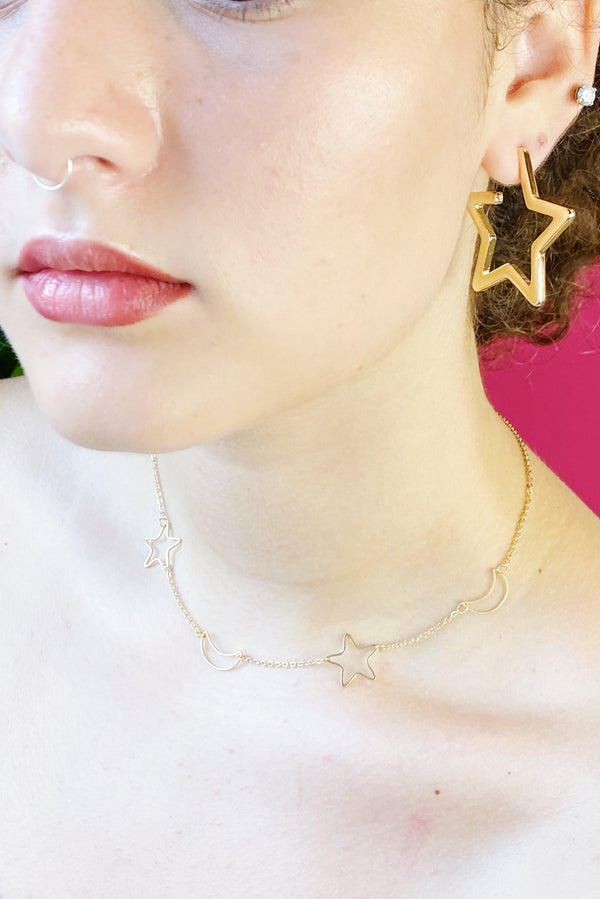 Close up of the earrings worn by model