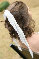 Trendy white hair scrunchies from online clothing Boutique Ellison + Young make the perfect hair accessory