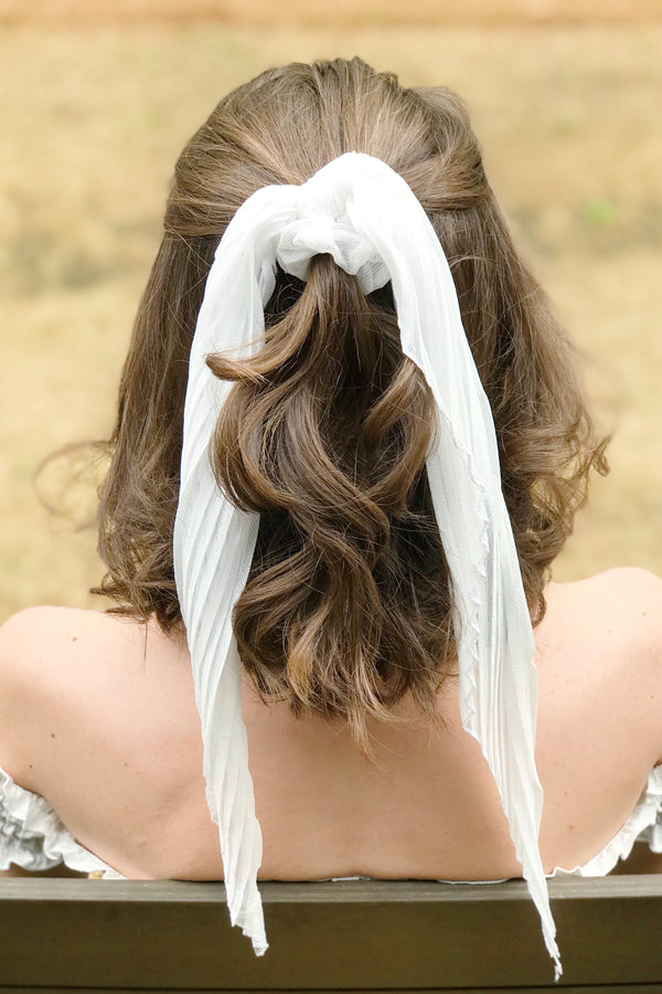 Trendy white hair scrunchies from online clothing Boutique Ellison + Young make the perfect hair accessory