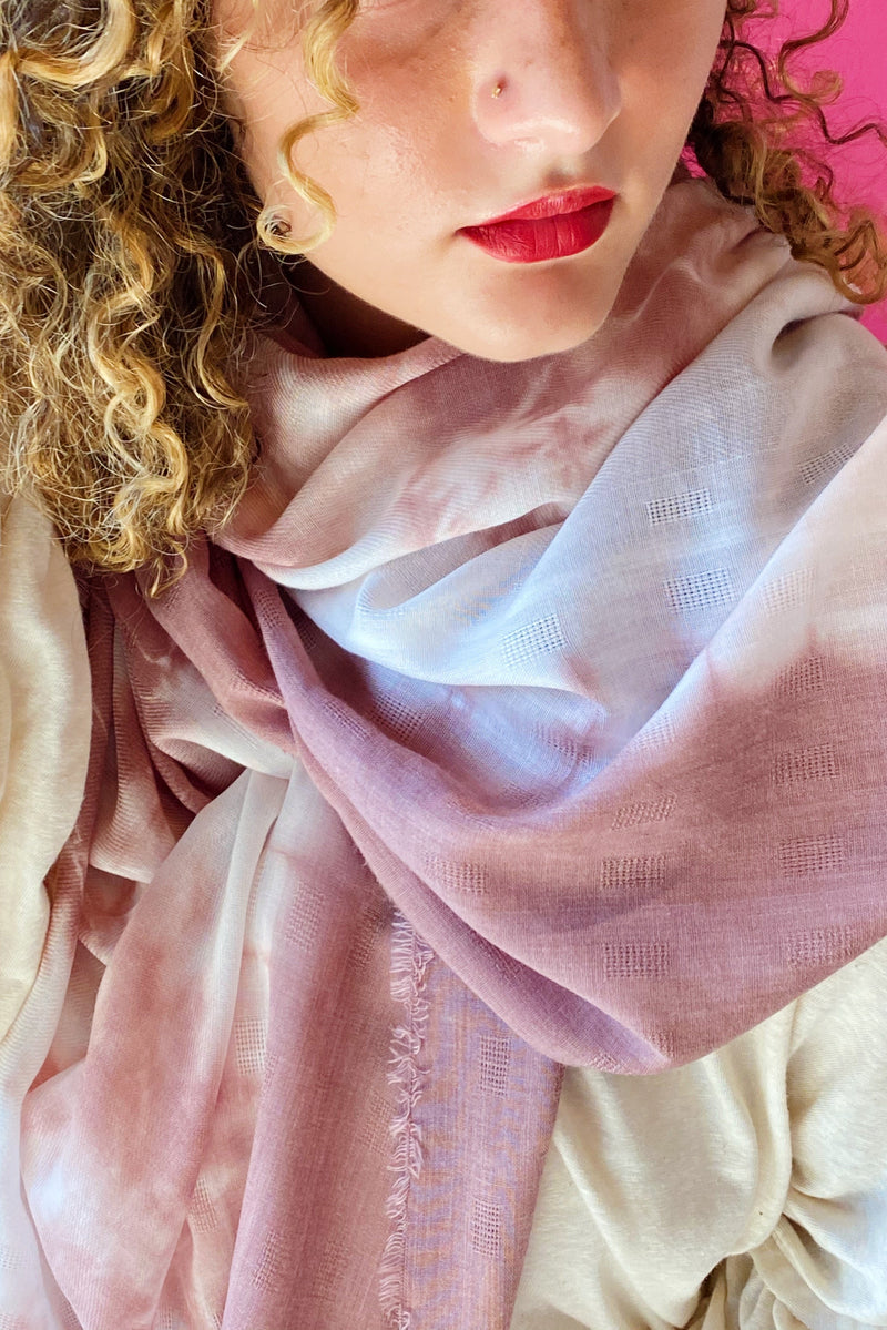Close up of model wearing scarf around neck 