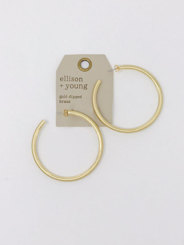 Small satin gold hoop earrings from online Jewelry Boutique Ellison + Young shown in packaging