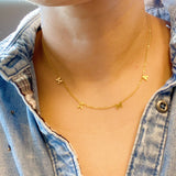 Gold chain necklace featuring a “Mama” initials in a polished gold finish, designed as a meaningful everyday or giftable piece.