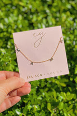 Gold chain necklace featuring a “Mama” initials in a polished gold finish, designed as a meaningful everyday or giftable piece.