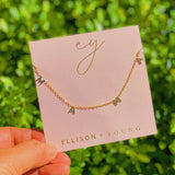 Gold chain necklace featuring a “Mama” initials in a polished gold finish, designed as a meaningful everyday or giftable piece.