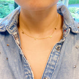 Gold chain necklace featuring spaced letter charms that spell “NANA” in a polished gold finish, designed as a meaningful everyday or giftable piece.